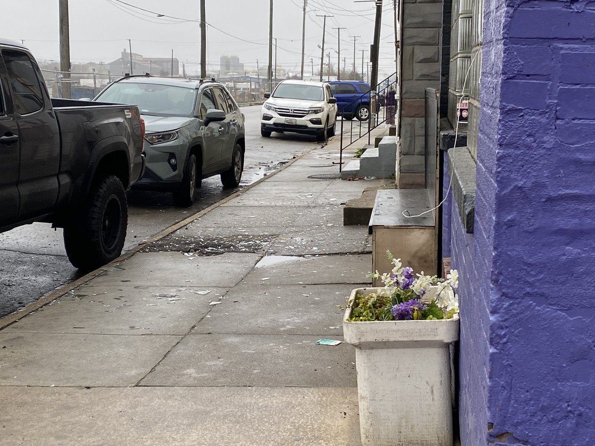 Windows blown out at nearby buildings and shattered glass on the sidewalks from the impact of the powerful coal dust explosion