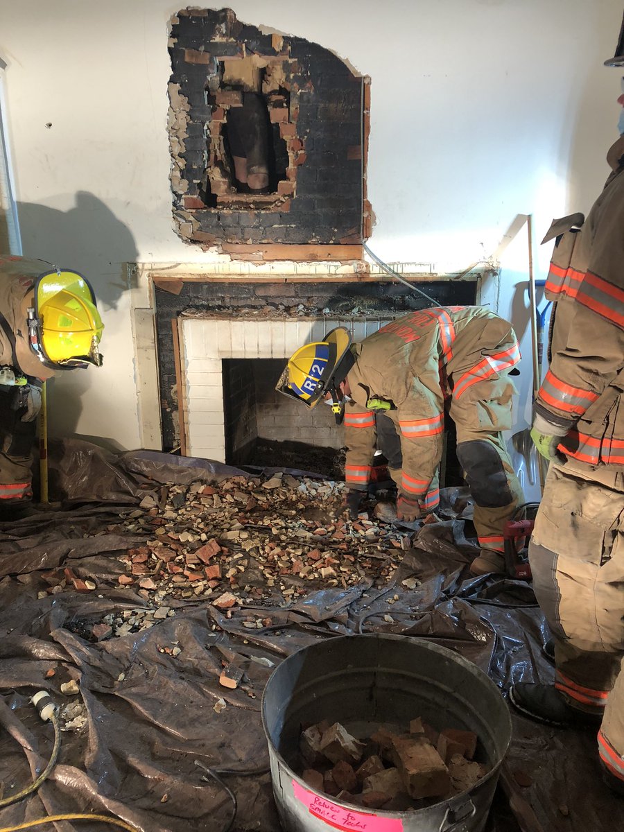 assist PD removing a man stuck in chimney, he was not authorized to be there. Rescue crews methodically removed the wall & bricks from around the chimney. He was extracted ~730a &amp; transported to trauma center, ~2 dozen FFs on scene