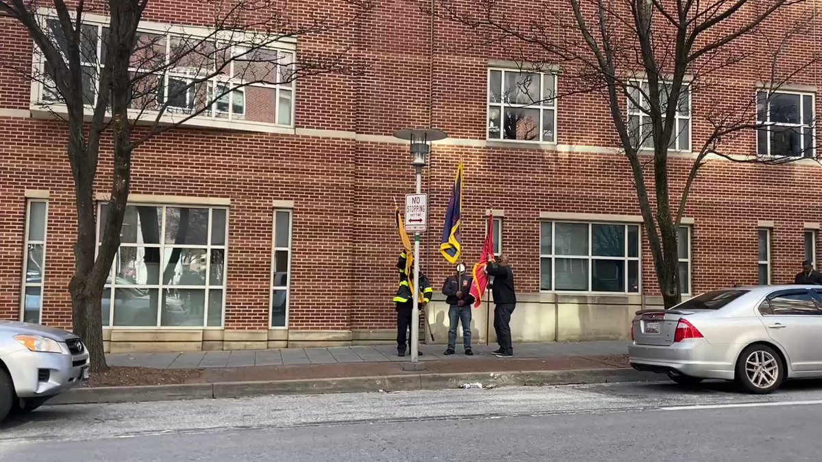 Members of the fire department have arrived carrying a fire dept.