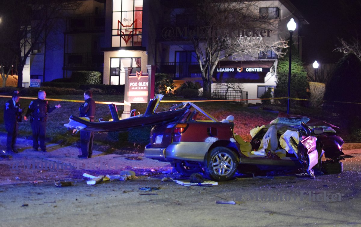 A vehicle crashed down the street from the shell casings. It was so damaged that it looked like a giant had ripped it in half