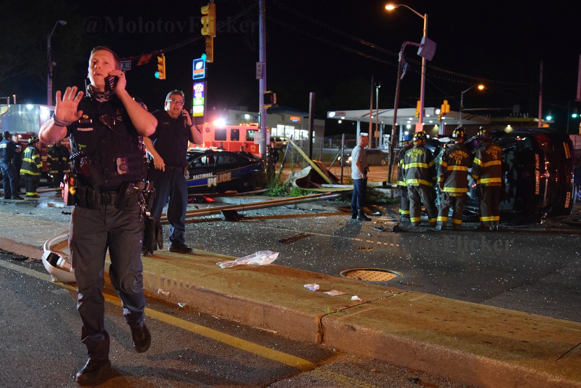 Two Baltimore police patrol cars were involved in a collision in Southwest Baltimore early Wednesday. One of them took out a streetlight and flipped on its side. The other car had a damaged hood and engine. The condition of the officers who were driving is unknown at this time