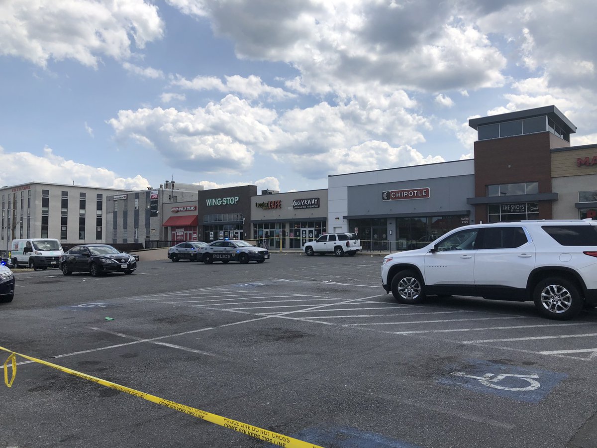 At the scene of a shooting at Iverson Mall in Temple Hills, Maryland. Three people were shot and the suspects fled. 