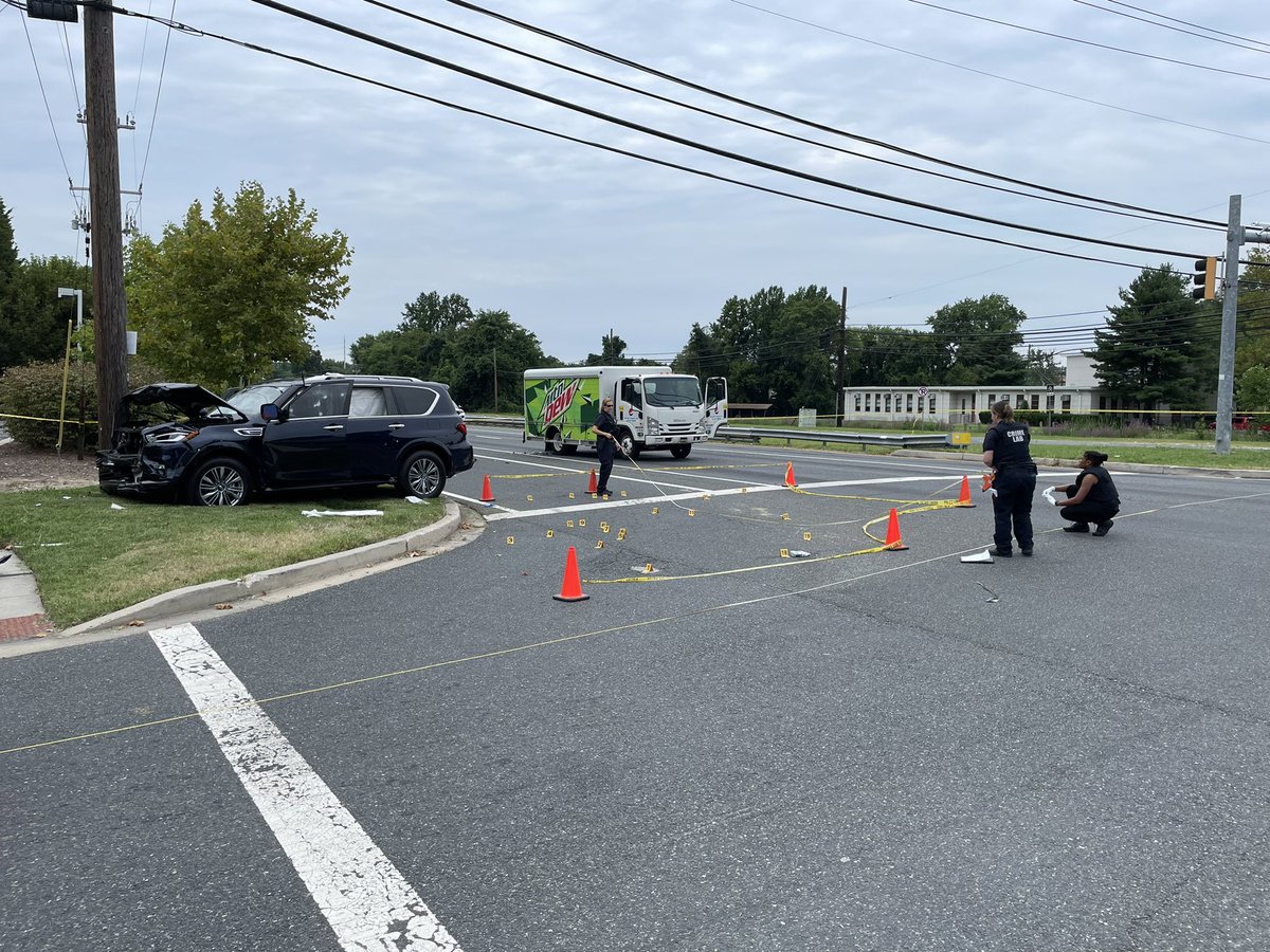 Multiple bullet holes can be seen down the side of this blue SUV. Baltimore County Police say around 10:15am two people were shot at the intersection of Martin Blvd and Compass Rd in Middle River