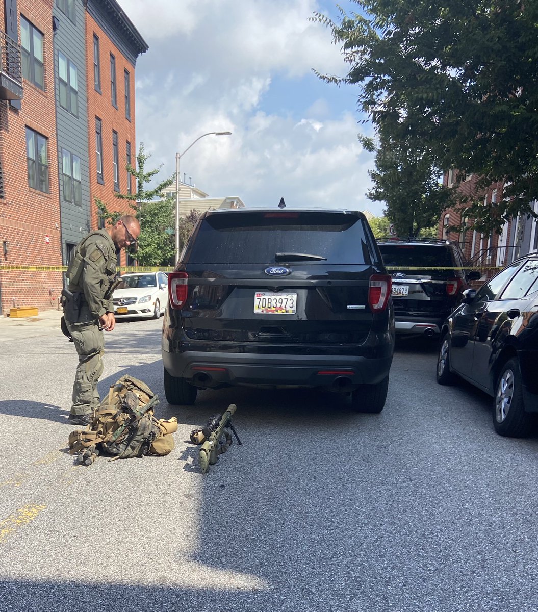 Lots of heavily armed officers; Barricade situation continues after shooting on Light Street 