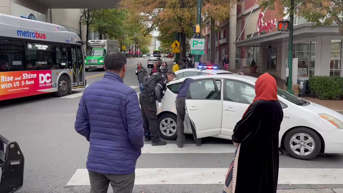 Montgomery County police investigating a shooting in downtown Silver Spring at Fenton and Elllsworth. A bullet smashed through the window of this car police are examining. Another bullet went through a window at the Cava. No one hit.