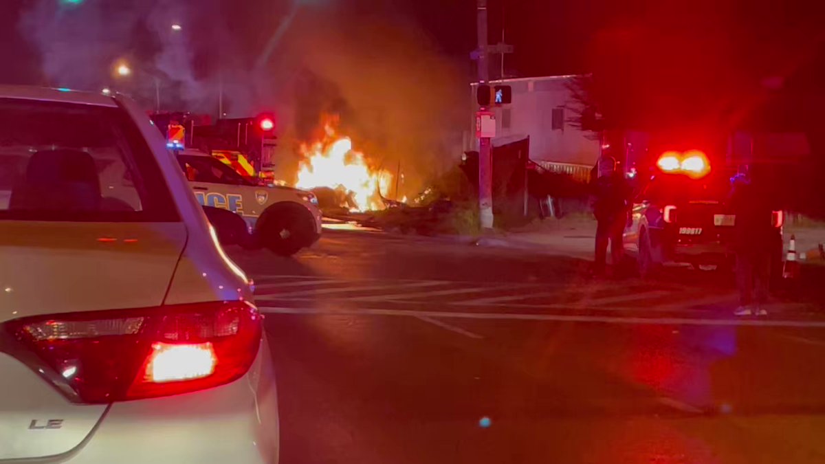 Baltimore Police and  Fire on the scene of a crash at Liberty Heights Avenue and Hilton Parkway. It appears one of the vehicles is completely engulfed in flames, several units on scene