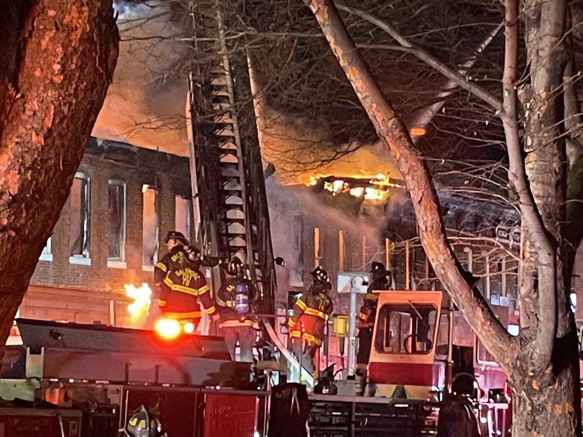 Scene of a 3-alarm @BaltimoreFire at times burning out of control along a block of rowhouses & store front businesses & a church in W. Baltimore along Fulton Ave near Reisterstown Rd.