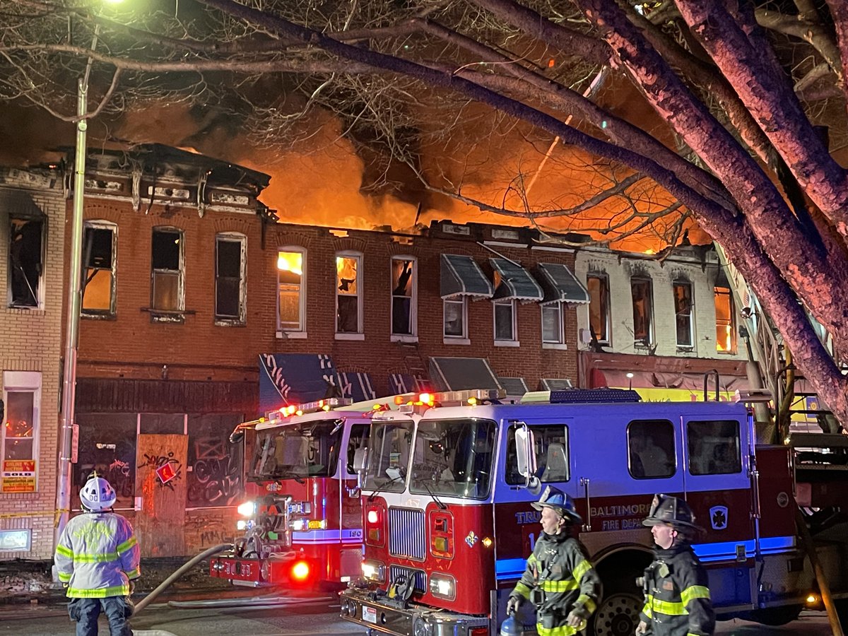 Scene of a 3-alarm @BaltimoreFire at times burning out of control along a block of rowhouses & store front businesses & a church in W. Baltimore along Fulton Ave near Reisterstown Rd. 