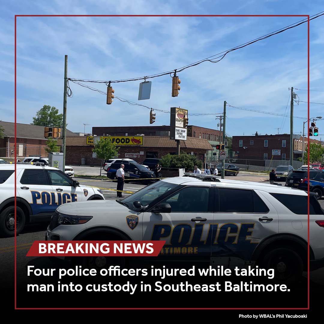 Four Baltimore police officers were injured while attempting to take a man into custody following an assault in the city's Ellwood Park neighborhood.