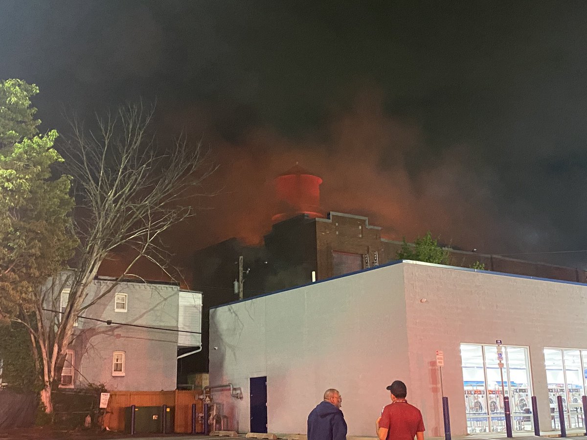 This is now a 6 alarm fire. The fire chief says the building has sub levels and they think there are mattresses at those levels. They are also relocating people in homes along a stretch of  block of Bentalou Street