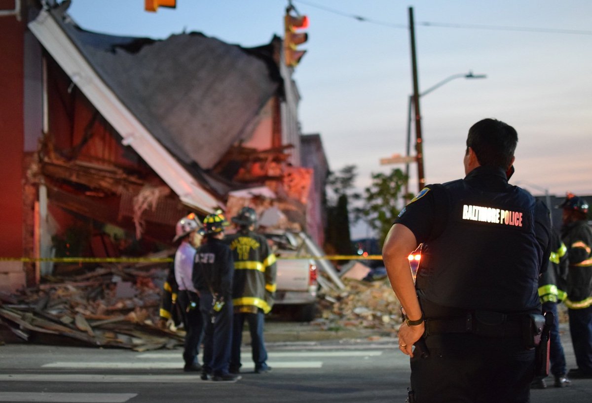 Baltimore police shut down the intersection of North Patterson Park and East Federal Street on Monday after a 64-year-old man drove a truck into a house, causing the brick building to partially collapse on top of the truck.