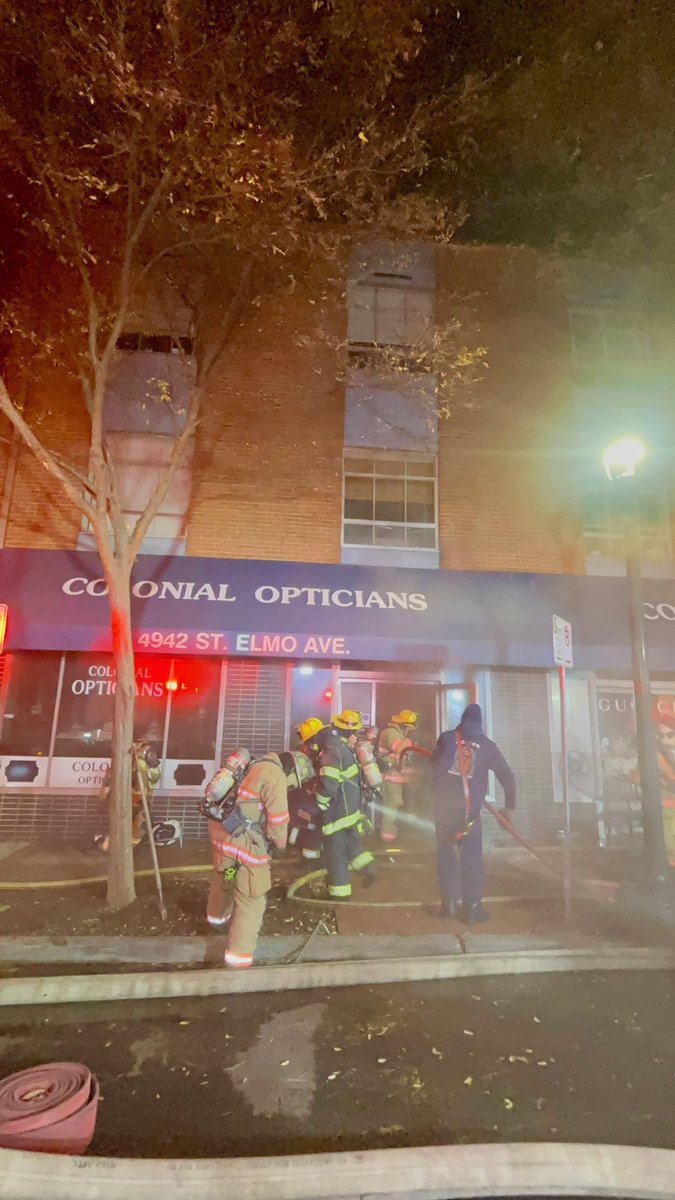 4942 St Elmo Ave, Colonial Opticians, n/t Cafe near Old Georgetown Rd, commercial building, small fire in office area, fire out, little or no extension, moderate smoke, no injuries