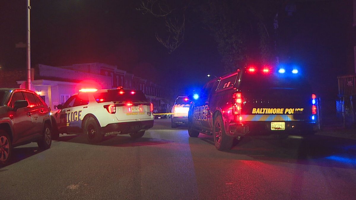 A dispute between neighbors led to one woman being arrested and another being hospitalized on Thursday night, Baltimore police said