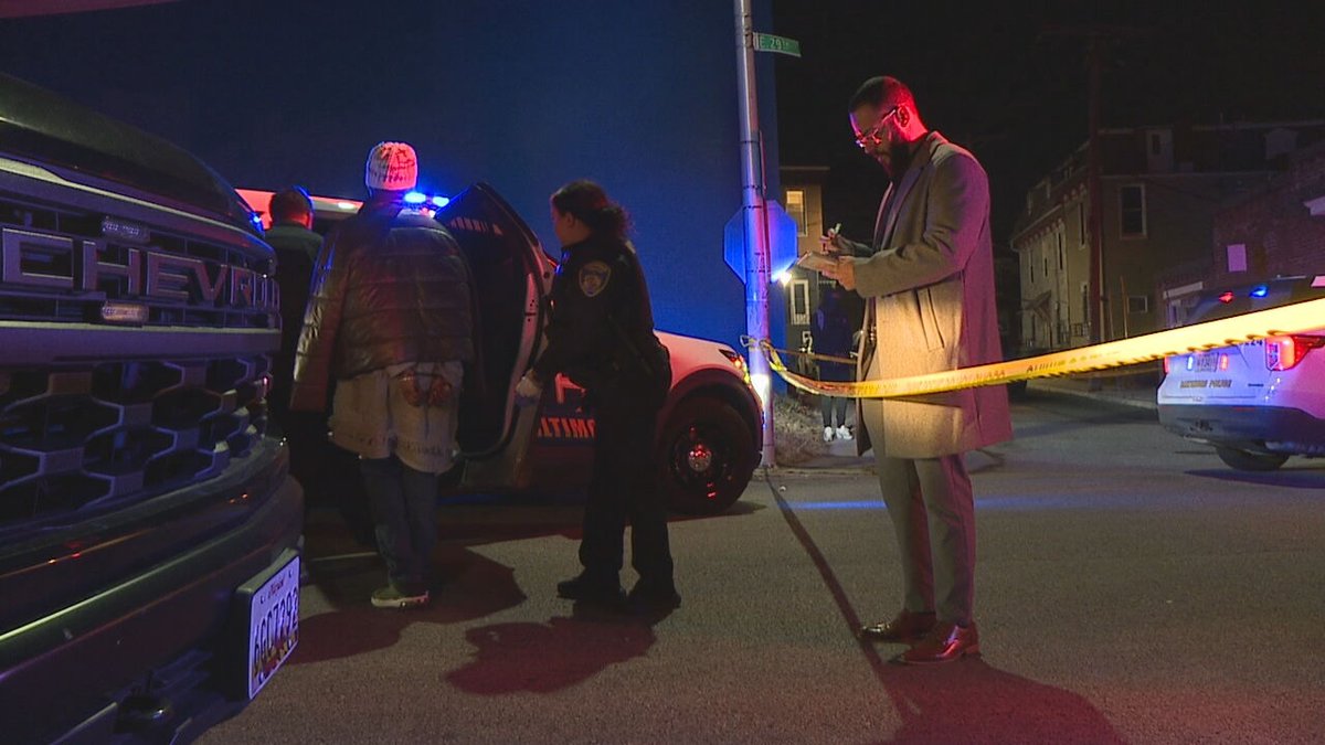 A dispute between neighbors led to one woman being arrested and another being hospitalized on Thursday night, Baltimore police said