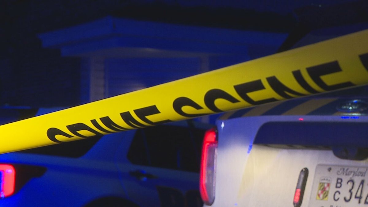 A dispute between neighbors led to one woman being arrested and another being hospitalized on Thursday night, Baltimore police said