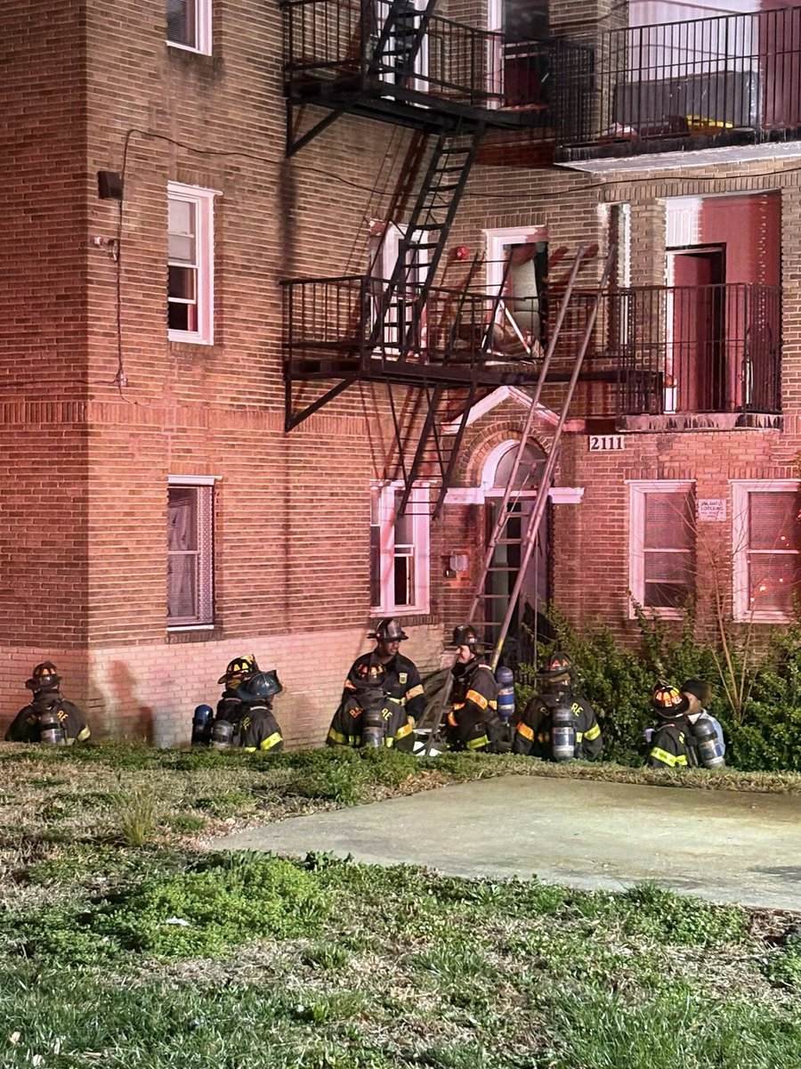 Two people and a firefighter are injured following an apartment building fire in northwest Baltimore on Saturday night.