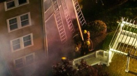 Gaithersburg, MD - Aerial photos from the scene of a reported house fire, four story apartment building, fire through the roof, 2nd alarm in the 9800 Blk of Mahogany Dr., Sawyer flats