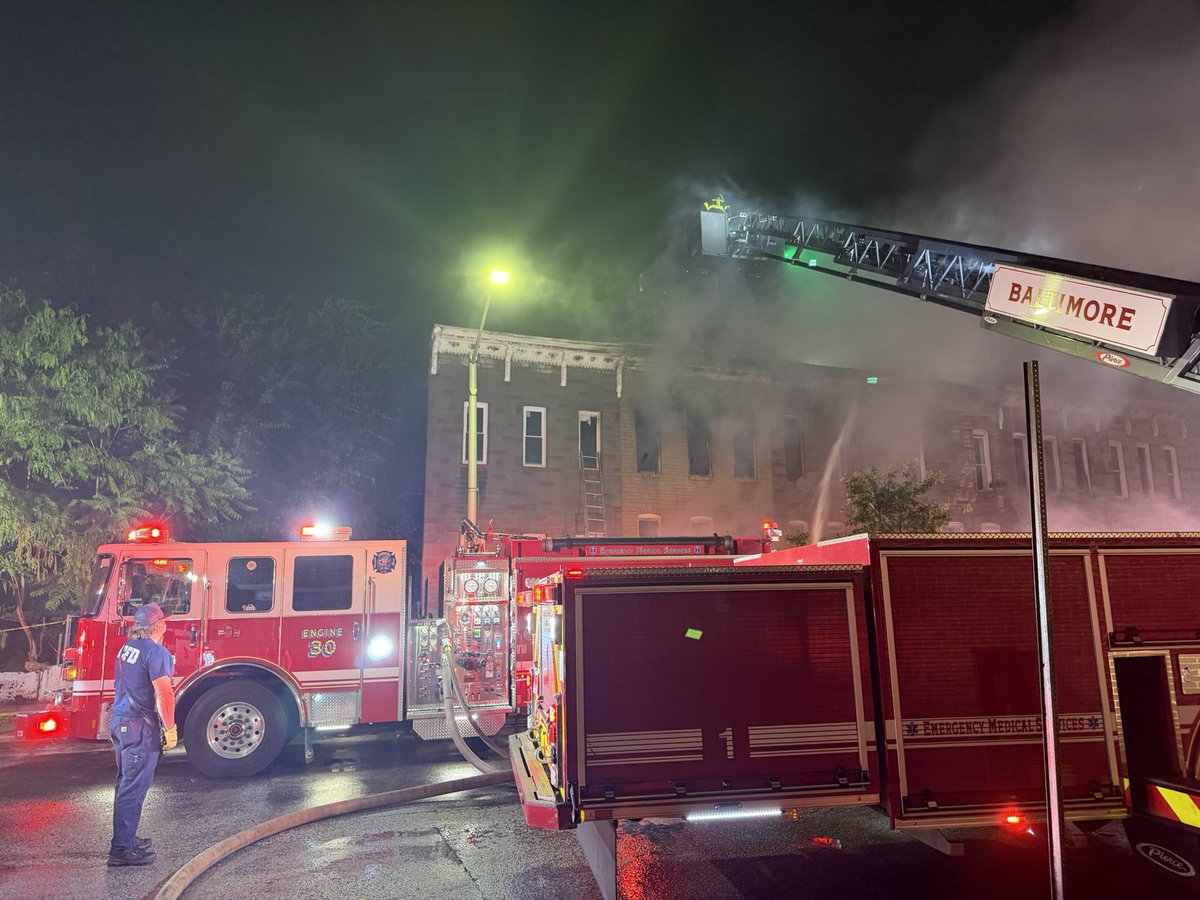 @BaltimoreFire was dispatched to the intersection of S. Pulaski St. & Ashton St. for reports of a dwelling fire. Upon arrival, units updated the location to the 2100 block of Ashton St. & reported fire showing from a two‑story, middle‑of‑the‑group