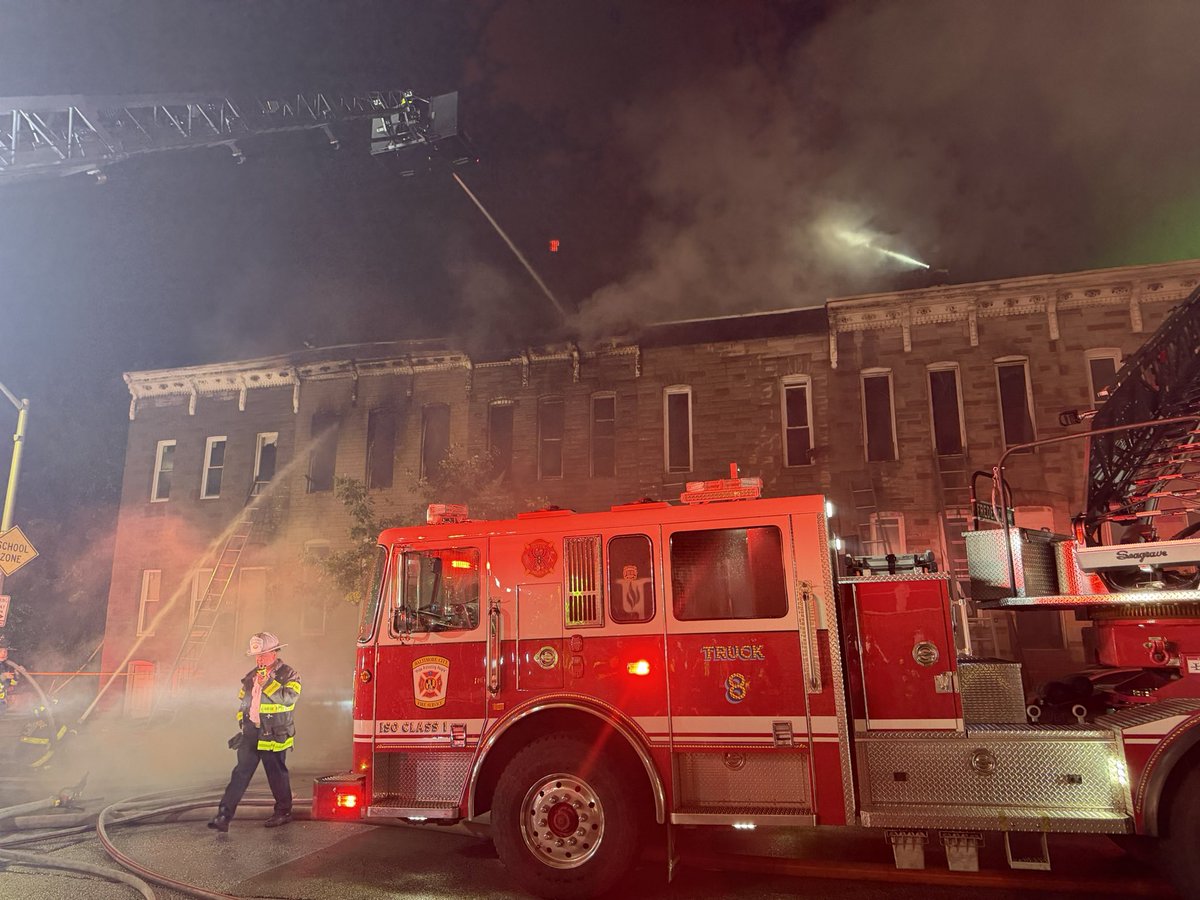 @BaltimoreFire was dispatched to the intersection of S. Pulaski St. & Ashton St. for reports of a dwelling fire. Upon arrival, units updated the location to the 2100 block of Ashton St. & reported fire showing from a two‑story, middle‑of‑the‑group