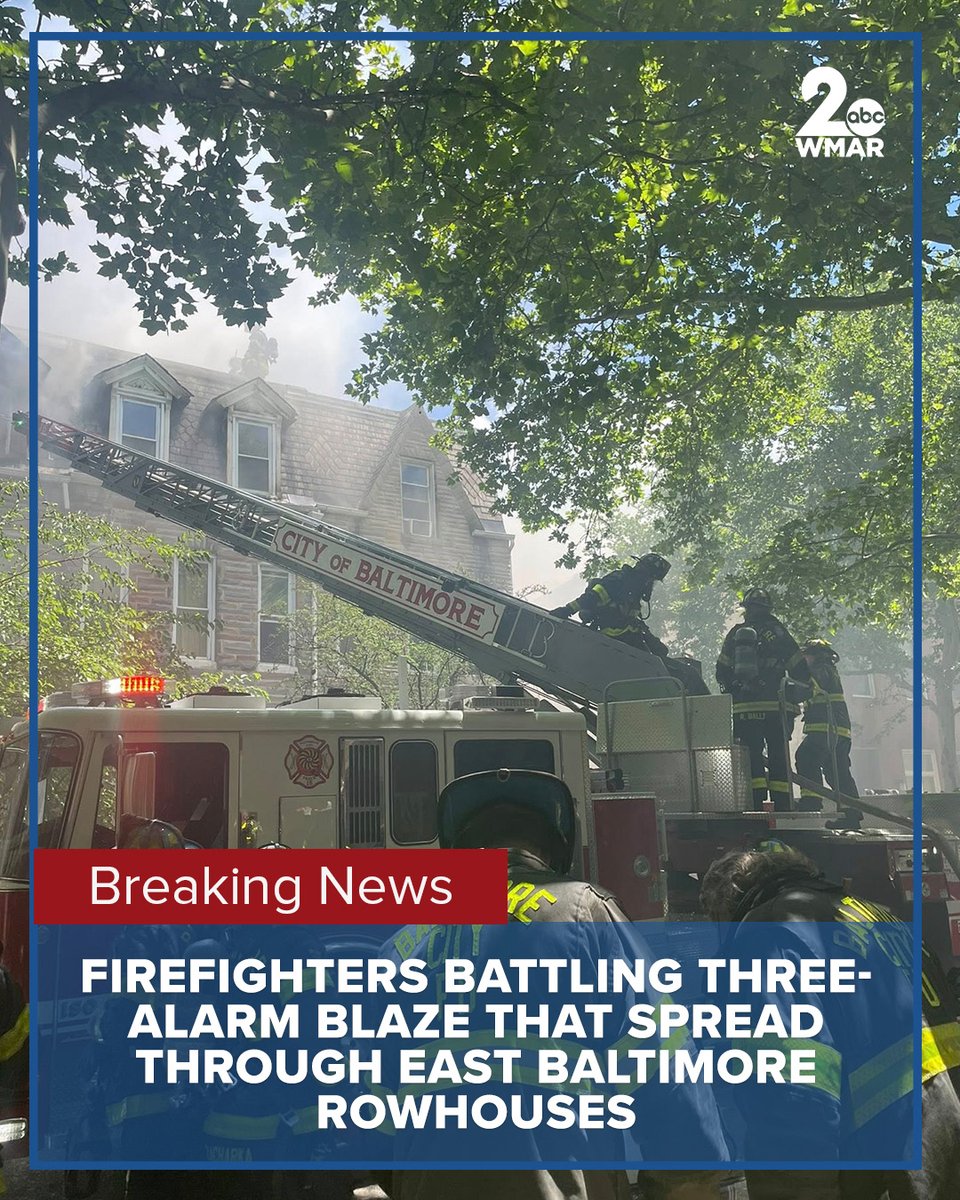 Firefighters are currently battling a three-alarm rowhouse fire in East Baltimore