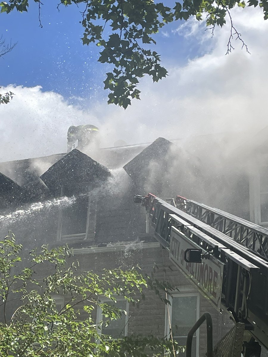 Crews battled a massive rowhome fire in Baltimore on Thursday