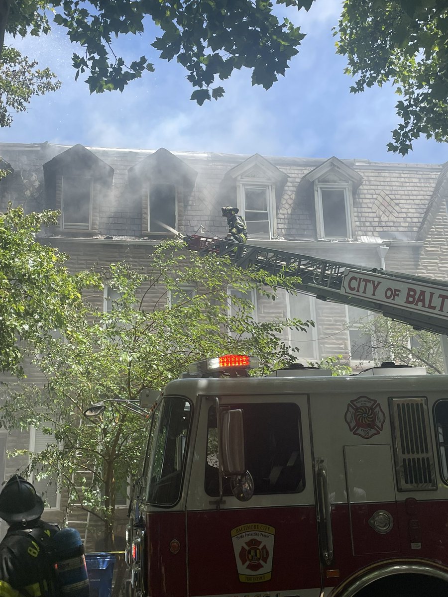 Crews battled a massive rowhome fire in Baltimore on Thursday